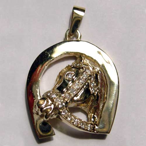 gold horsehead with diamond bridle inside horseshoe pendant