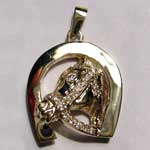 gold horsehead with diamond bridle inside horseshoe pendant