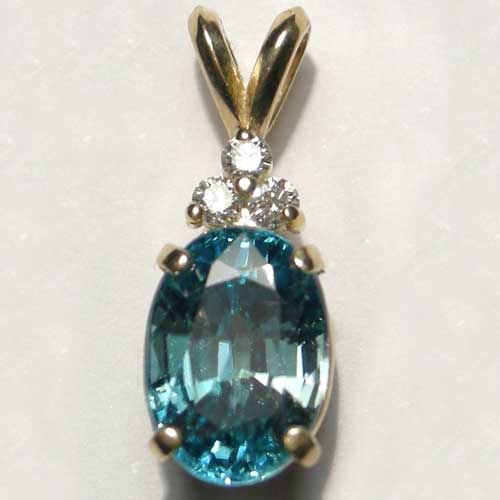 gold oval Blue Zircon pendant