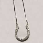 Custom white gold diamond horseshoe necklace