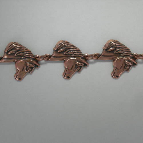 close up of horse head links of bracelet