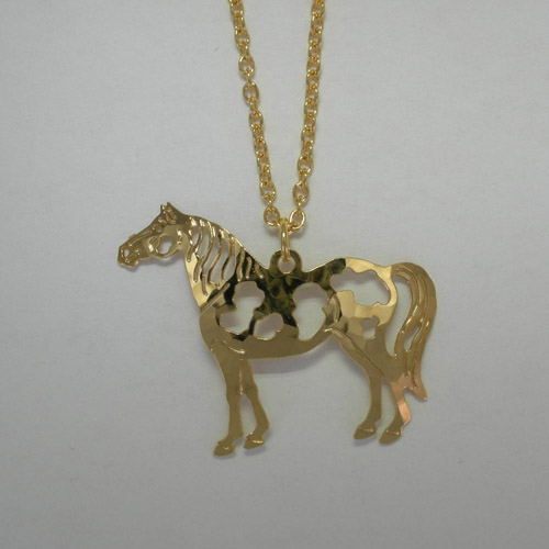 Close up of Pinto Horse pendant of necklace