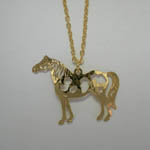 Close up of Pinto Horse pendant of necklace