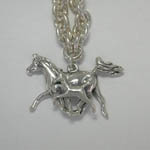 Close up of Arabian mare and foal charm of bracelet