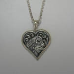Sterling Silver mare and foal horse heads in heart necklace