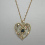 10 karat yellow gold Black Hills Gold heart shaped diamond and Sapphire nec
