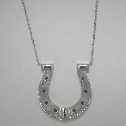 Custom 14 karat white gold horse shoe necklace close up