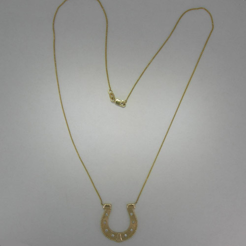 Custom 14 karat yellow gold and diamond horseshoe necklace