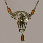 14 kt. y.g. plated three horse necklace with amber color crystals