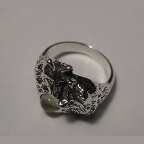 Side view of wolf and moonstone ring