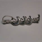Sterling Silver horseshoes and crop brooch