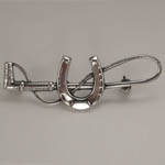 Sterling Silver horseshoe and crop brooch