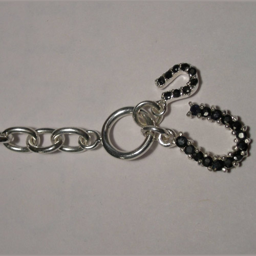 Sterling Silver clasp end of sapphire horseshoe bracelet