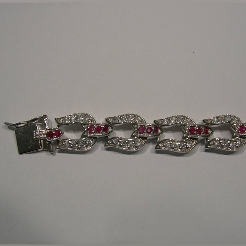 Clasp side of ruby and Cubic Zirconia horseshoe bracelet