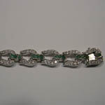 slot side of clasp of emerald and Cubic Zirconia horseshoe bracelet