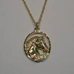 Black Hills Gold horse head in oval necklace