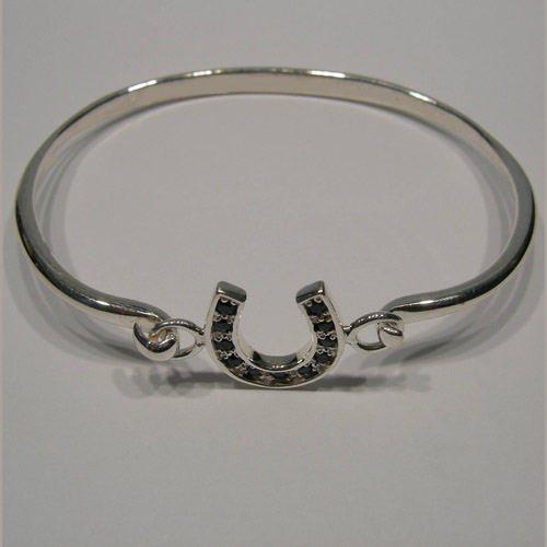 side view of sapphire horseshoe bangle bracelet