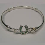 side view of childs emerald horseshoe bangle bracelet
