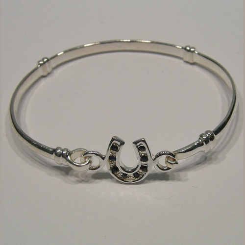 side view of childs sapphire horseshoe bangle bracelet