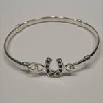 side view of childs sapphire horseshoe bangle bracelet