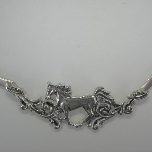 close up of gallolping horse in choker necklace