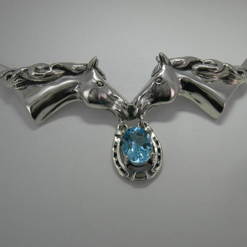 Close up of Sterling Silver Blue Topaz horse head pendant